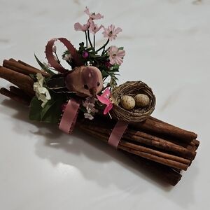 Rustic Cinnamon Stick Arrangement with Bird and Nest